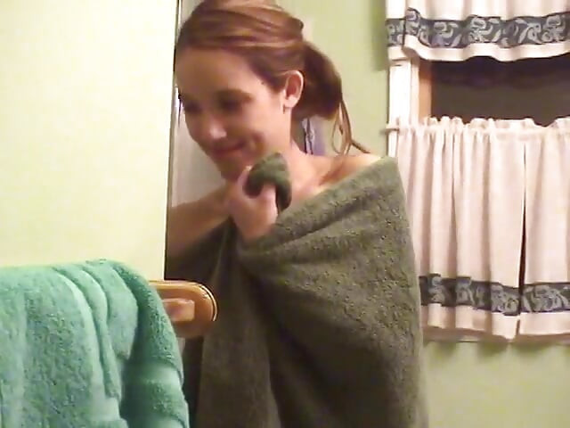Cute brunette teen soaps up in the shower and takes time to trim her bush
