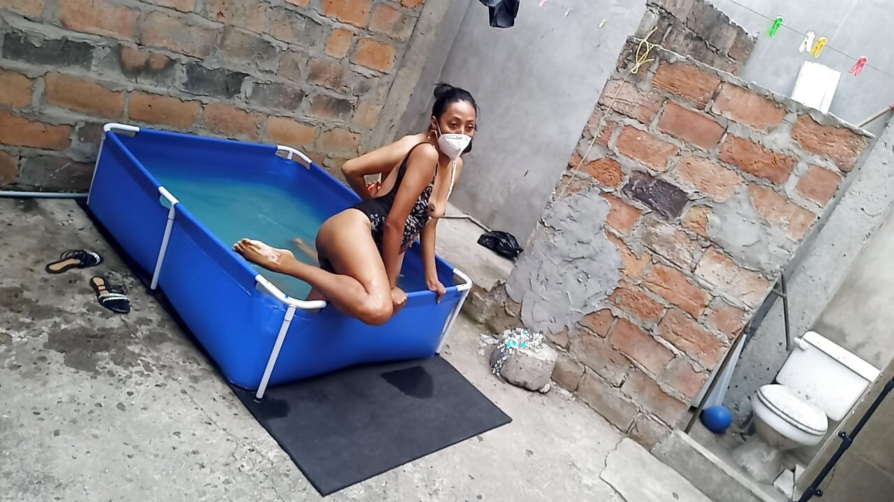 My neighbor is in the pool wearing a very tempting and sexy bikini. She's hot.