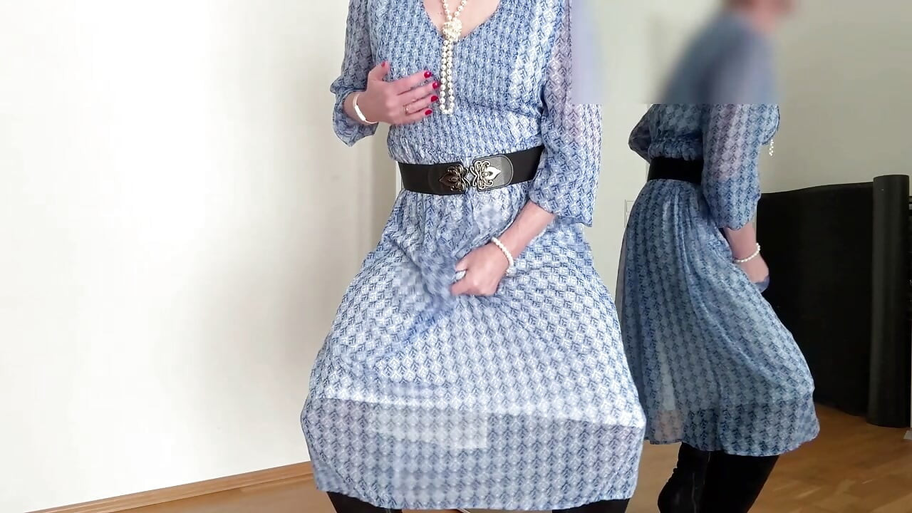 In a summery blue dress, boots and silk underwear