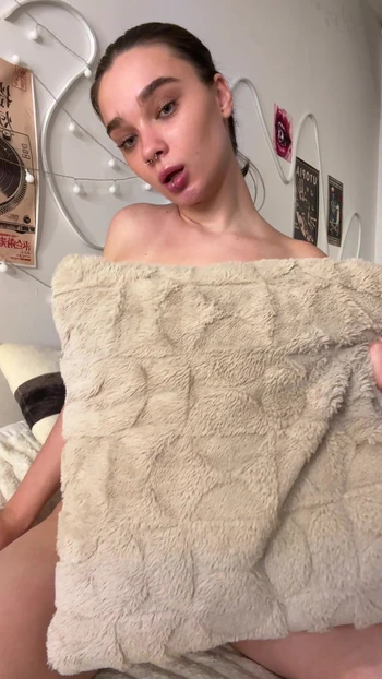 Pierced teen plays with her small tits