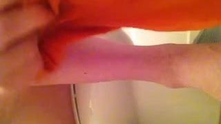 Putting on some orange tights and playing with my cock