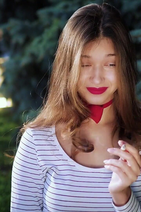Sultry Russian Girl Smoking Cigarette by Waves