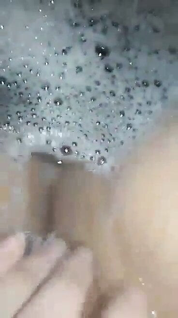 Teen girl masturbates in the bathtub