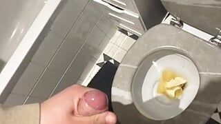 An 18-year-old masturbates in his toilet while he prepares food.