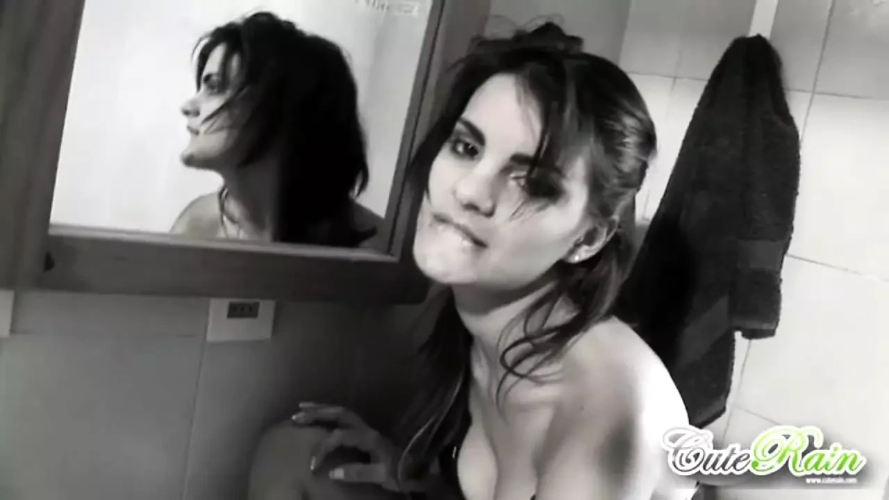 Cute Rain showing medium tits in bathroom