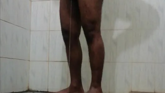 A horny Black Asian guy pissing in underwear and bathing in bathroom