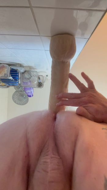 Taking big dildo in shower