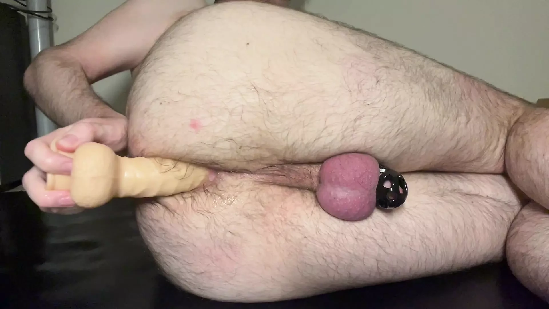 First time Anal organs while caged using dildo