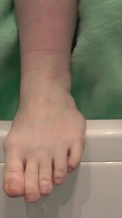 Key moment from "Mature feet in soapy foam. Amateur foot fetish close-up. ASMR."