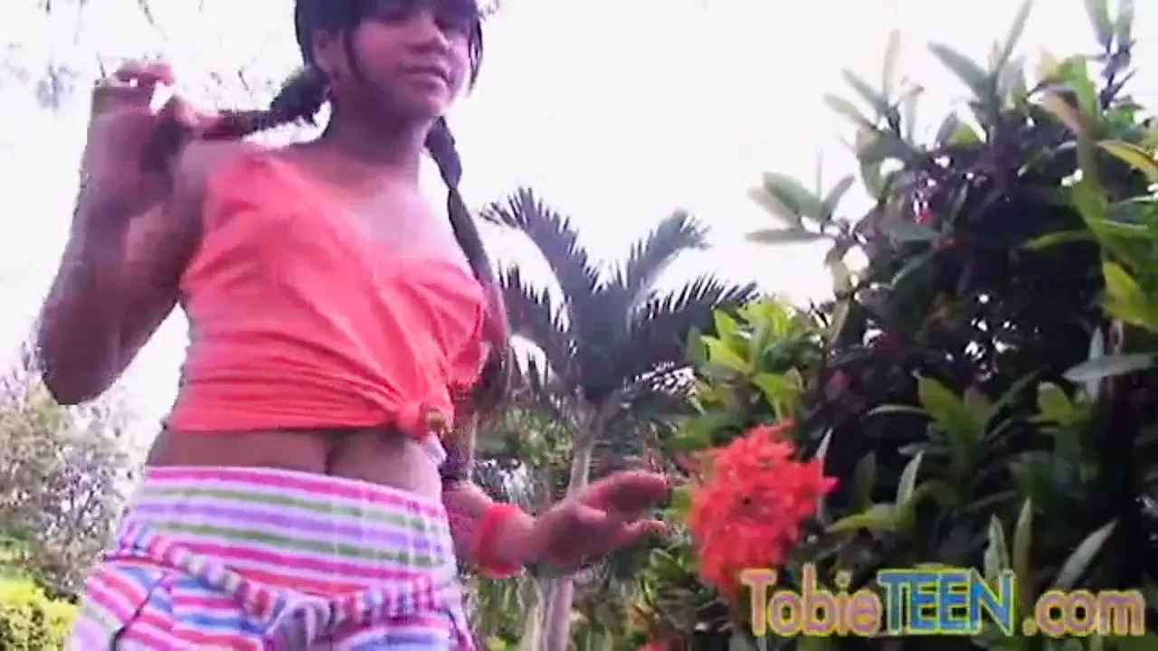 Tobie Teen Fingering her tight pussy in the garden