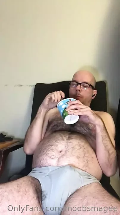 Gainer Eating Shake In Chair