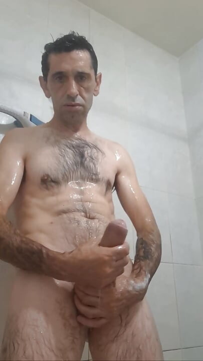 Straight guy with a huge cock jerks off in the shower until he gets all the milk out.