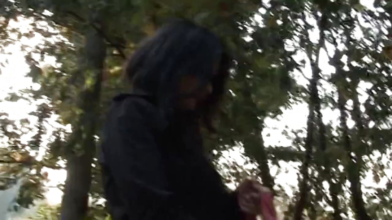 Hot and sexy milf fingers her pussy on the bench of a park