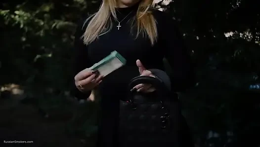 Hot Blonde Babe Smoking One Black Cigarettes in Nature