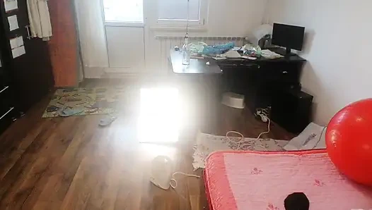 Amateur woman has fun trying on clothes and cutting them.