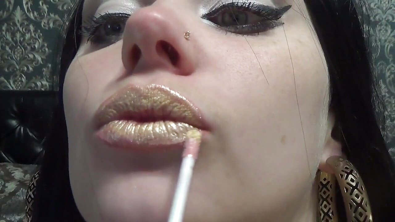 Golden lips teasing and lollipop sucking and licking