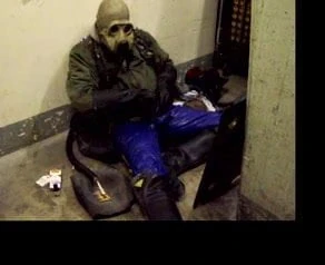 Gasmask smoking skinhead with blue rubber pants wanking