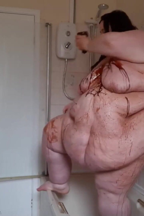 Ssbbw body covered in chocolate sauce in shower