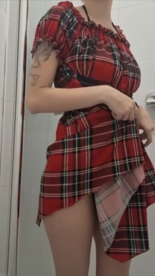 Naughty beauty takes off her dress to show off her sexy lingerie