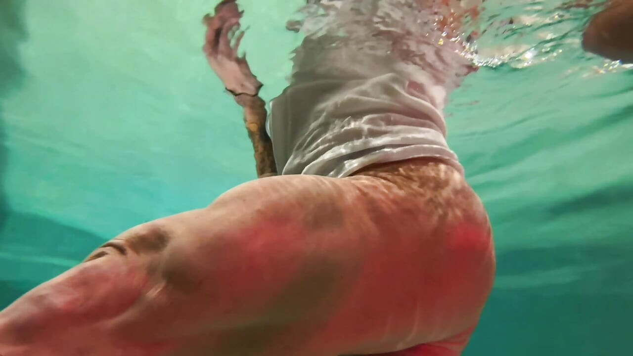 Amazon Kandy Flexes Her Massive Biceps in Her Hotel Pool