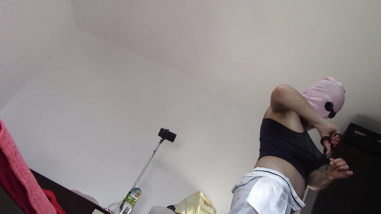 Amateur wife dancing naked at home. Amateur woman has fun trying on clothes and cutting them.
