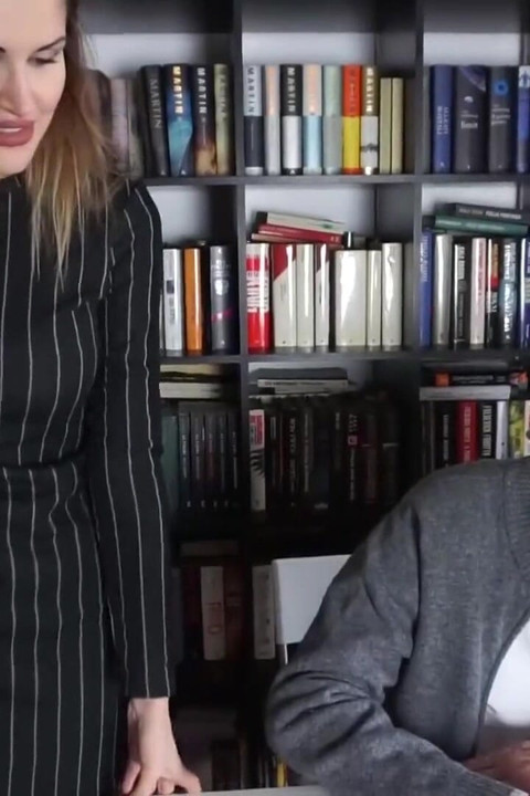 Femdom chick punishes her male slave in the office