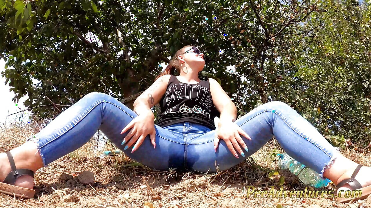 Chubby girl talking on the phone with her boy friend pee in her jeans