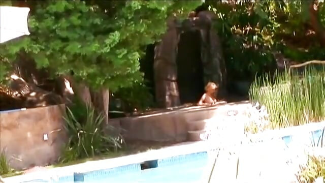 Horny blonde sucks dude's cock by the pool