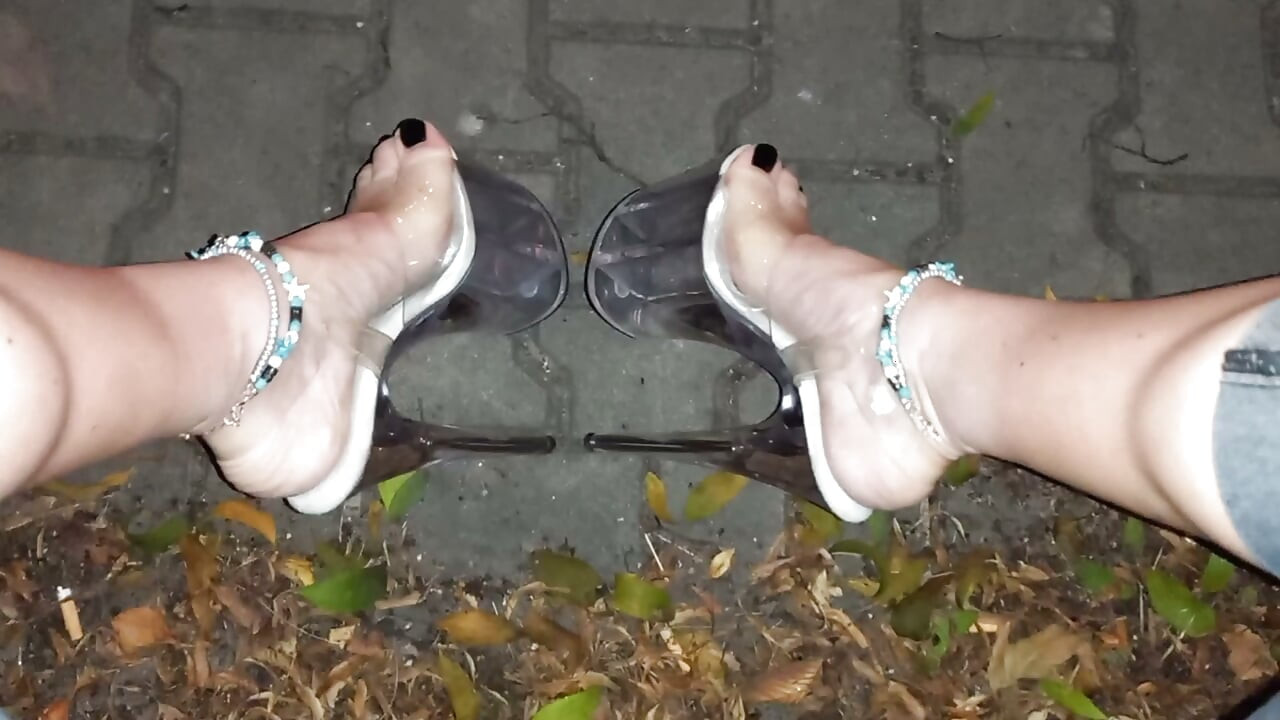 nighttime crossdressing on a public street in 20cm stripper heels, black toes, and black claws