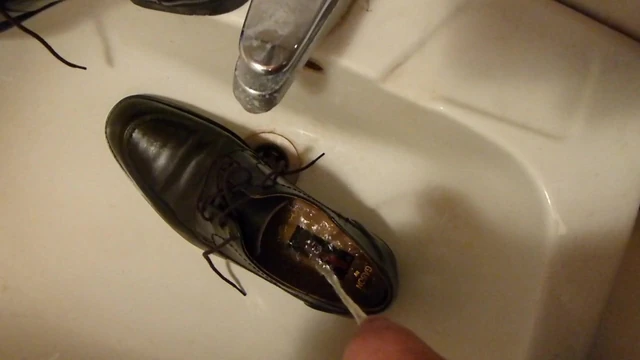 Piss in men's dress shoe