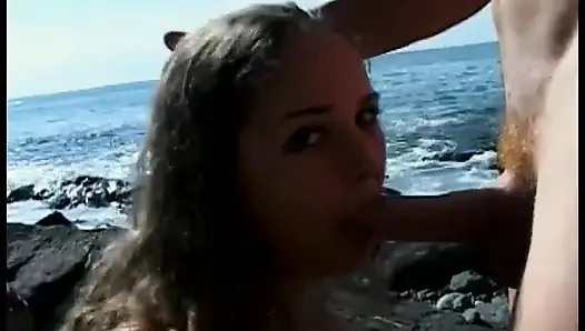 Curly-Haired teen sucks older guy's cock at the beach then fucks