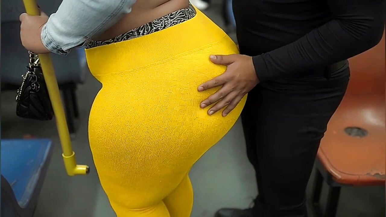 "Masked BBW Teases Huge Ass in Shiny Yellow Leggings on Public Bus"
