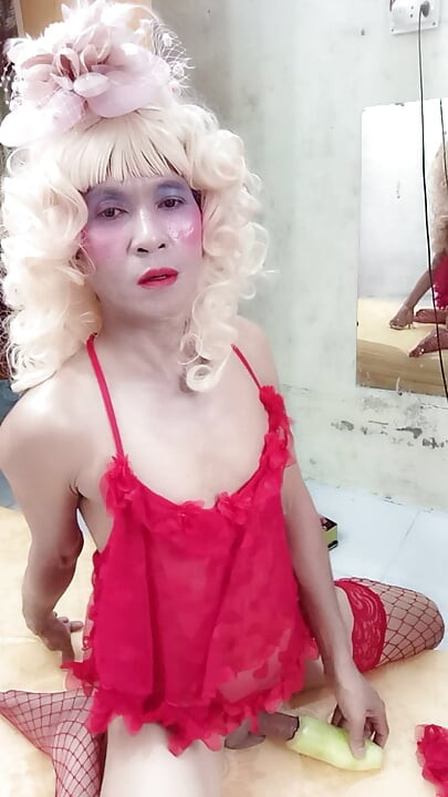 Oanh Le transgender wearing suggestive clothes to play with cans pretending to be too happy