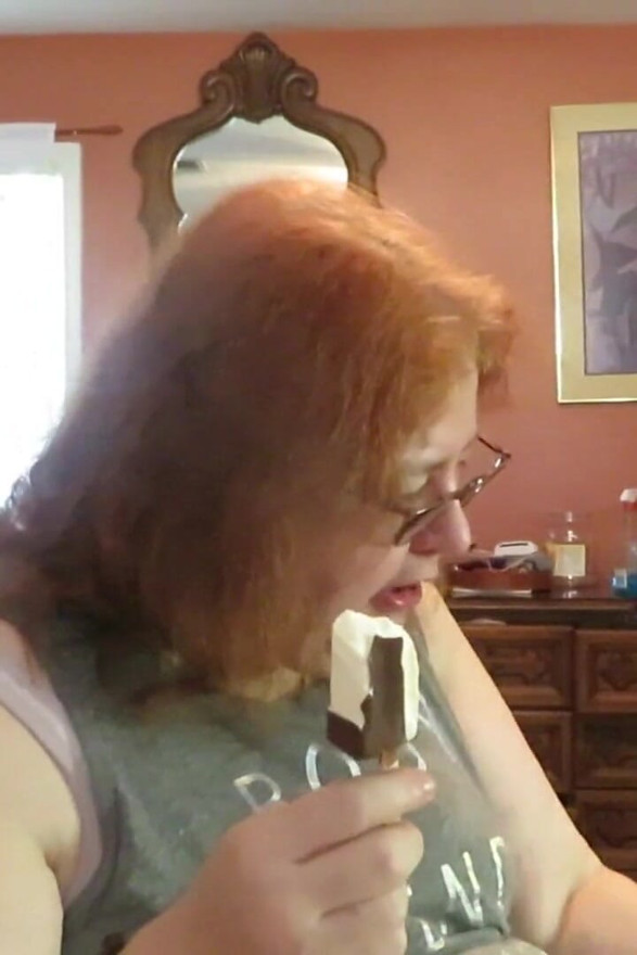 BBW nurse Vicki enjoys eatting a chocolate vanilla ice cream popsiscle