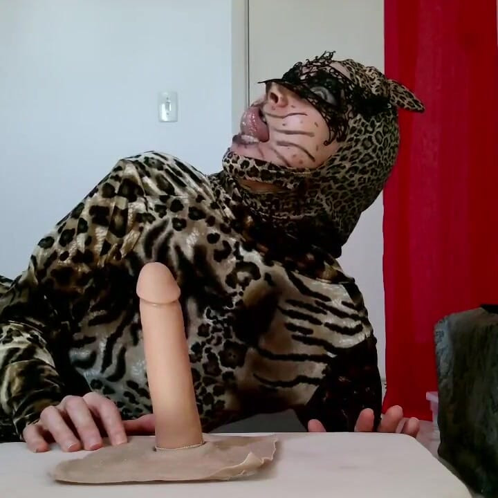 Hungry CatWoman shows how to use tounge on dick