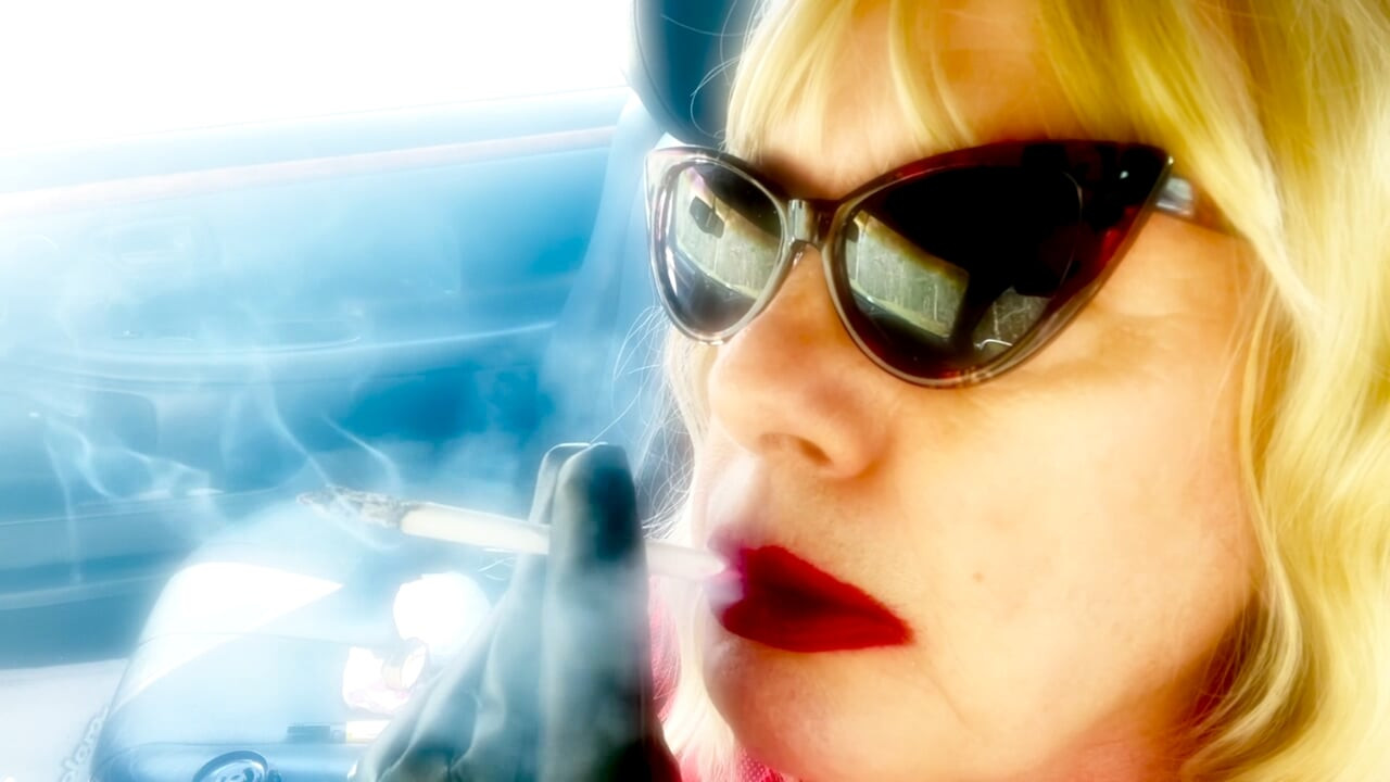 MATURE BLONDE SMOKING VS120 MENTHOLS WITH CAT SUNGLASSES