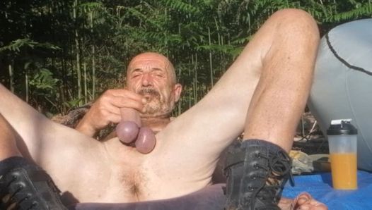 Guy spreading legs showing cock and balls