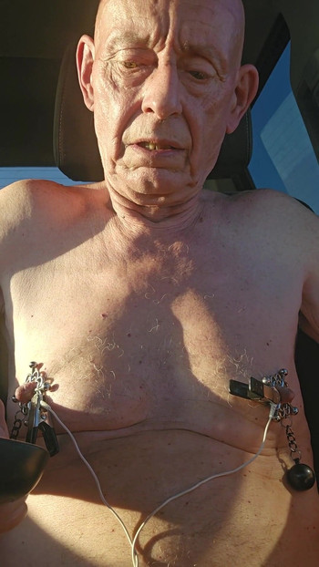 Captivating moment from "nipple torture with spiked clamps and tens unit"