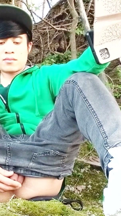 Risky masturbation outdoors a man's voice caught this cute gay twink with his balls hanging out, jerking off his uncut foreskin | Clip 1
