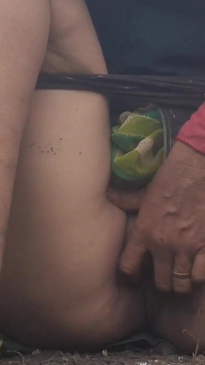 Captivating moment from "In the outdoor open field, my sister-in-law is urinating with fingers in her pussy, showing her"