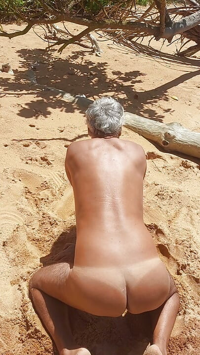 Ladysilva on the beach naked on all fours showing off her big sexy tanned ass