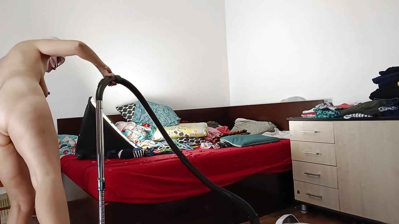 Amateur wife vacuuming in the bedroom. Amateur wife gives me a handjob until I cum.