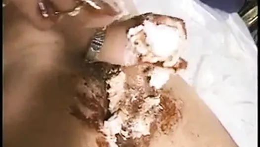 Playful blonde covers dude's cock with whipped cream and syrup then rubs it off