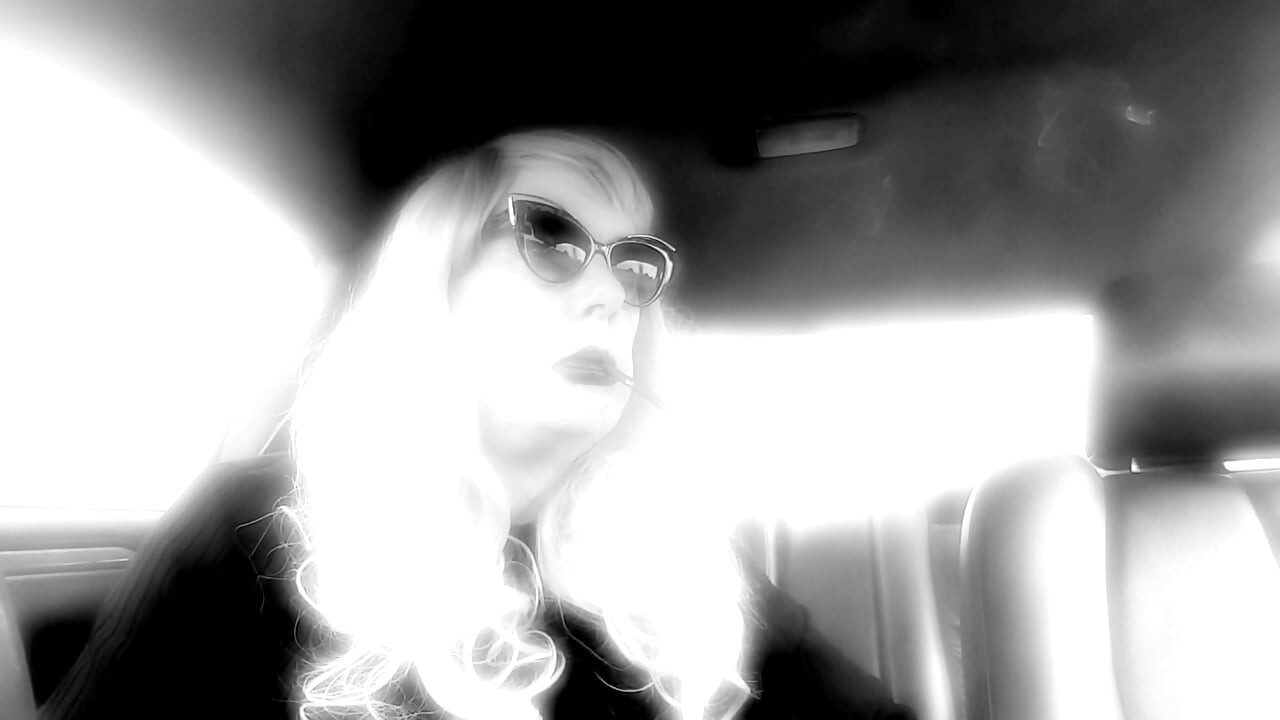 MATURE TG CD SMOKING MORES IN MY RIDE - LOTS OF DANGLING LONG CIGARETTES
