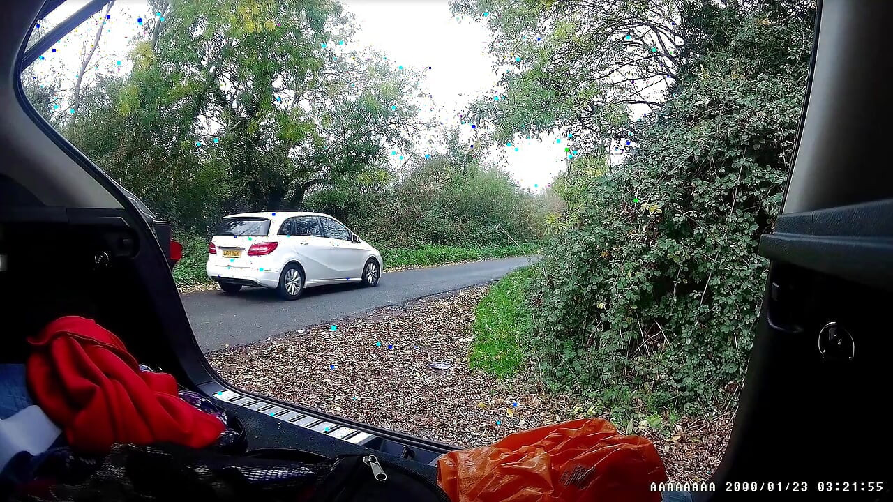 Just getting changed parked at side of road with cars driving past