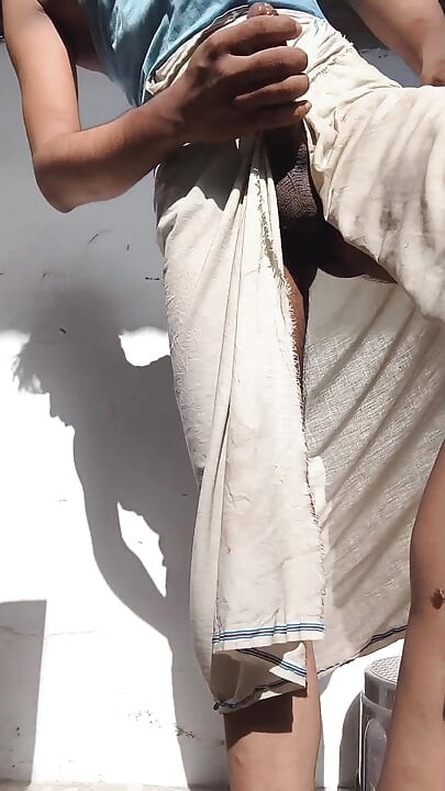 Young guy rubs his thick penis with oil