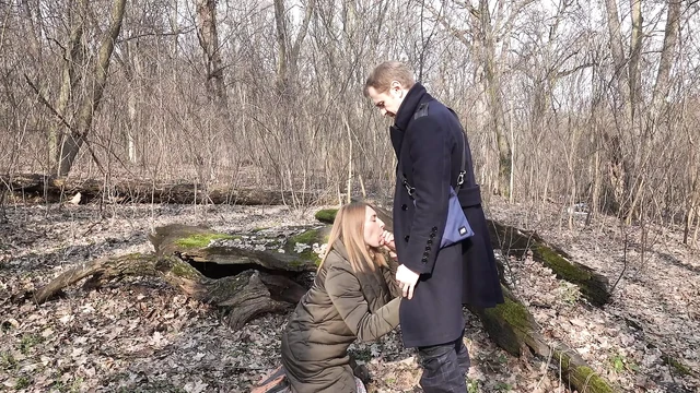 In the forest, a girl got on her knees and start sucking cock