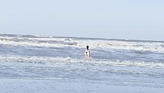My neighbor loses her clothes at the beach.