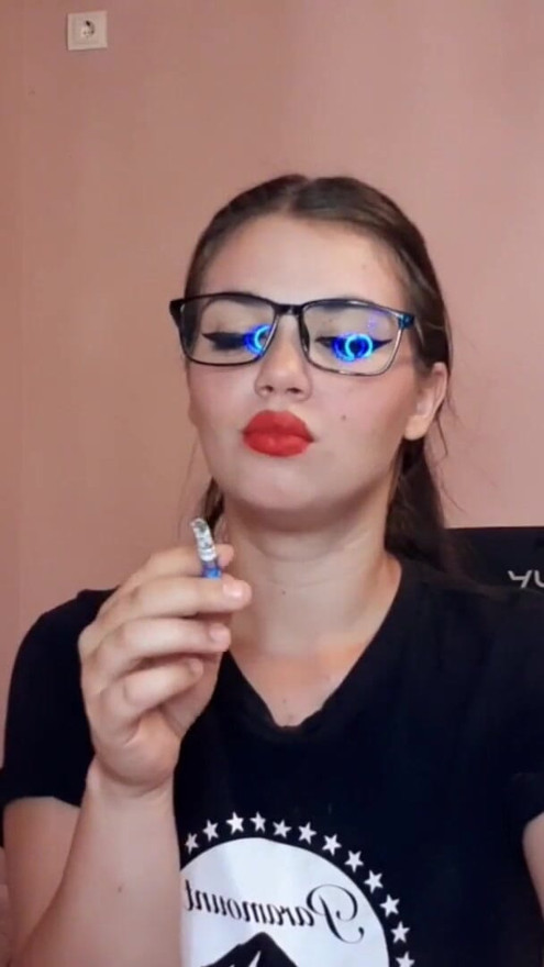Sensual brunette smoking and wearing geek glasses | Clip 3