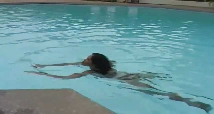 2 sexy Latina's presenting latex fetish in the pool and on the beach